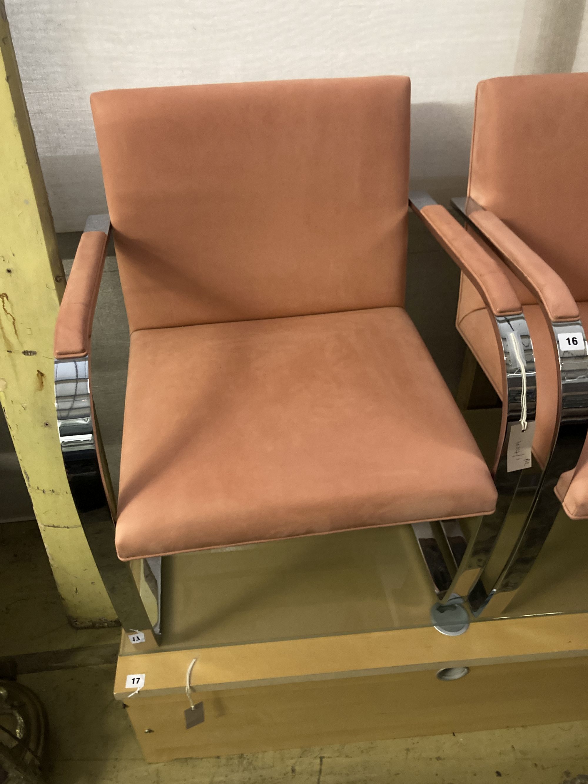 A pair of Knoll International BRNO chairs, after Mies Van De Rohe, upholstered in peach suede fabric, width 58cm depth 54cm height 79cm